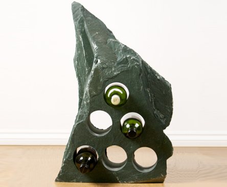 Store nine bottles of your favourite wines using Honister Green Slate. Image shown is a six hole representation of our wine racks and each is unique in shape and style. However, if you like the shape of this version let us know and we can source a piece similar to the one shown.