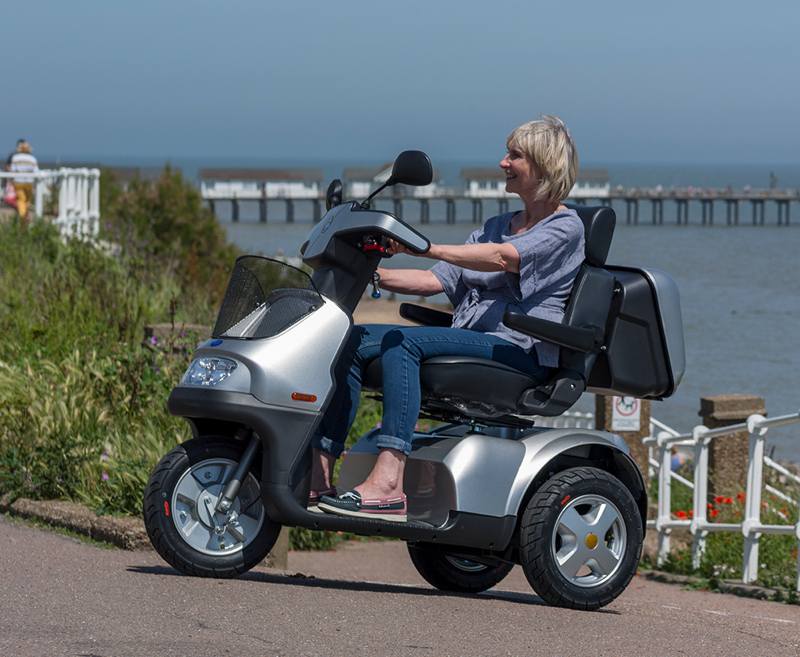 The iconic Breeze brand from TGA has an established and respected reputation for providing unsurpassed reliability, comfort and quality. The 4-wheel Breeze S4 delivers superb stability and traction when tackling slopes and challenging terrain as seen when it appeared on BBC Top Gear.
This scooter has all the capabilities for enjoyable countryside and coastal rambles with a 30-mile range and a powerful transaxle motor. The 3-wheel Breeze S3 delivers the same exceptional performance and enhanced manoeuvrability. If all-weather independence is a must then both models are available with optional rigid canopy for protection against wind and rain.
[symple_button url=