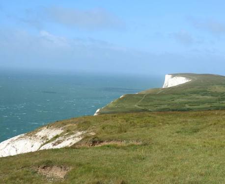 The iconic Needles form the western tip of a band of chalk which crosses the centre of the Isle of Wight ...