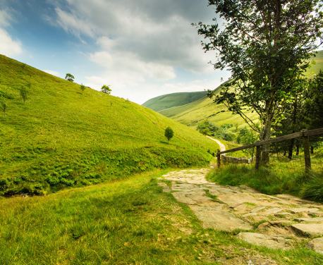 The best walking routes in the Peak District, exploring the iconic hills, wooded valleys, gritstone edges and family trails of Britain’s oldest national park.