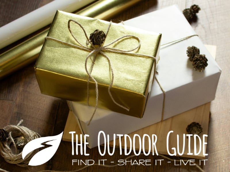 Gift Guide; The Outdoor Guide Christmas parcel wrapped in gold foil and string.